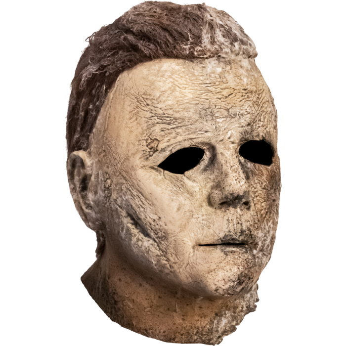 This is a Halloween Ends Michael Myers mask with brown hair and the side of the face, ear, lips and hair is weathered and burnt.