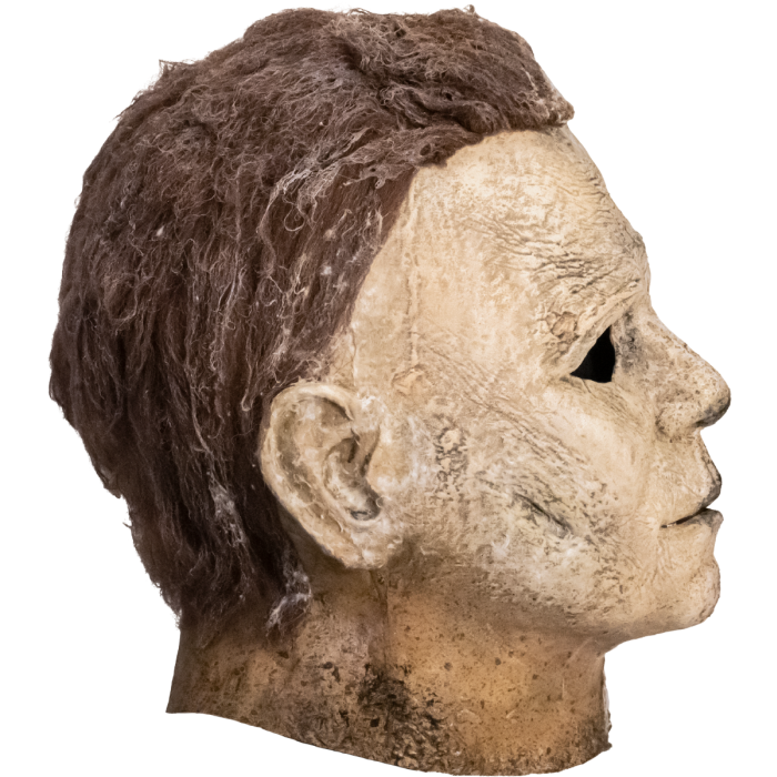This is a Halloween Ends Michale Myers mask with brown hair and the side of the face, ear, lips and hair is weathered.