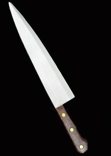 This is a Halloween II Michael Myers Butcher Knife that is foam and has a silver blade and a brown handle with three gold dots.