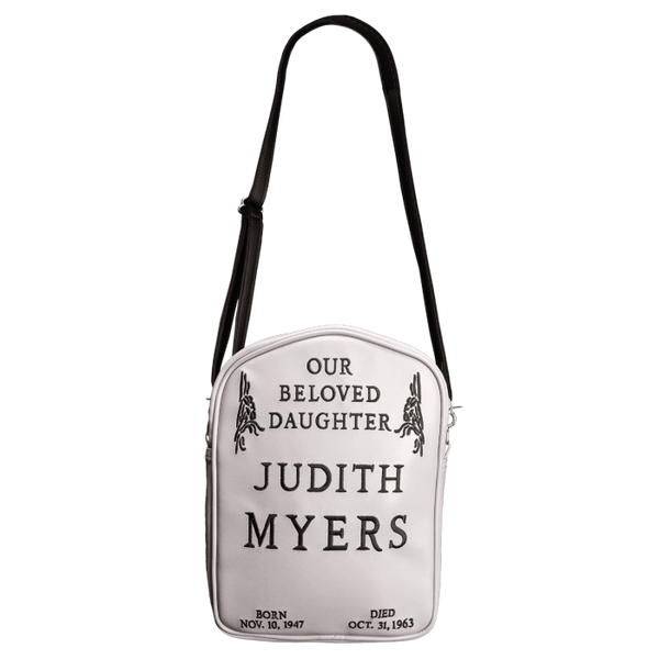 This is a Halloween Judith Myers tombstone purse and backpack that is grey with a black strap and black lettering