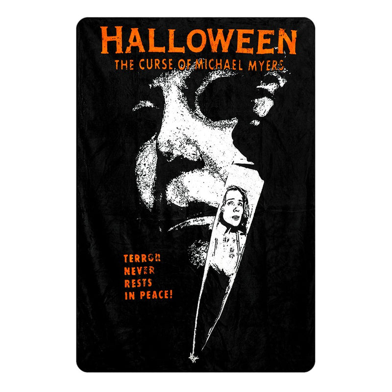 This is a Halloween 6 Curse of Michael Myers fleece throw that is black and orange and he is holding a knife with the reflection of a girl in it.