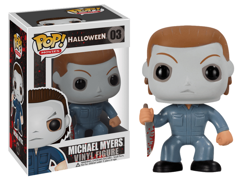 This is a Halloween Michael Myers Funko pop and he has a white face, blue coveralls and is holding a bloody knife in his hand.