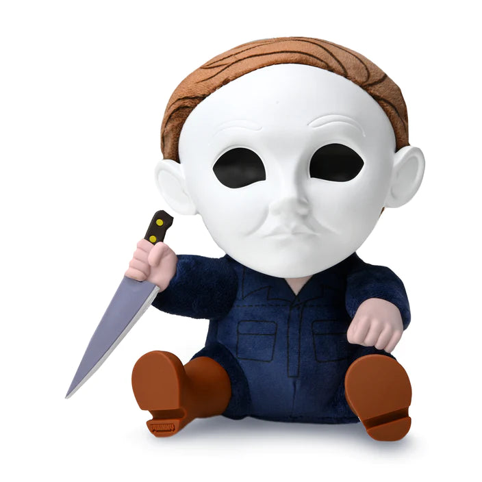 This is a Halloween 2 Michael Myers Kidrobot Roto Phunny and he has a white mask, blue coveralls, silver knife, brown hair and black eyes.