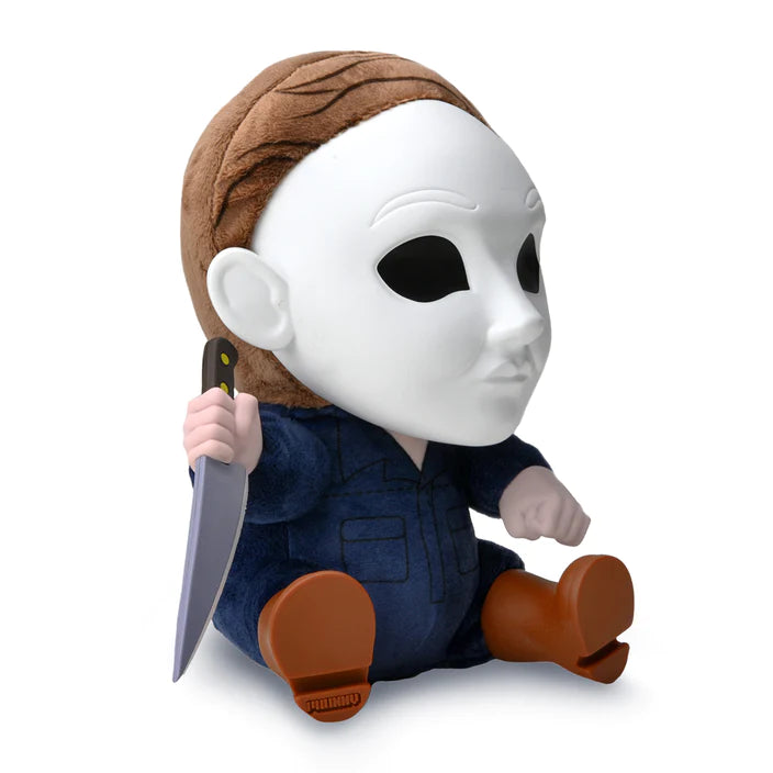 This is a Halloween 2 Michael Myers Kidrobot Roto Phunny and he has a white mask, blue coveralls, silver knife, brown hair, brown boots and black eyes.