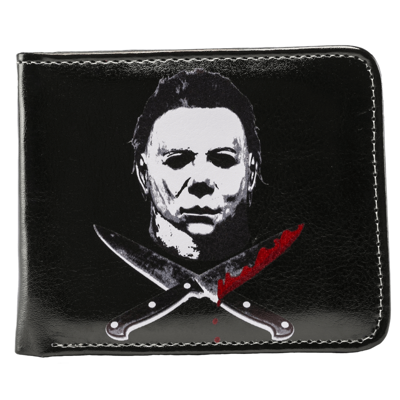 This is a Halloween Michael Myers wallet that is black with a white face and bloody crossed knives.