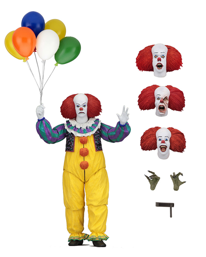 This is an It Movie 1990 NECA ultimate action figure with Pennywise who has a white face, red nose, orange red hair, yellow suit with orange balls and green and purple stripes, 3 heads, balloons and 2 hands.