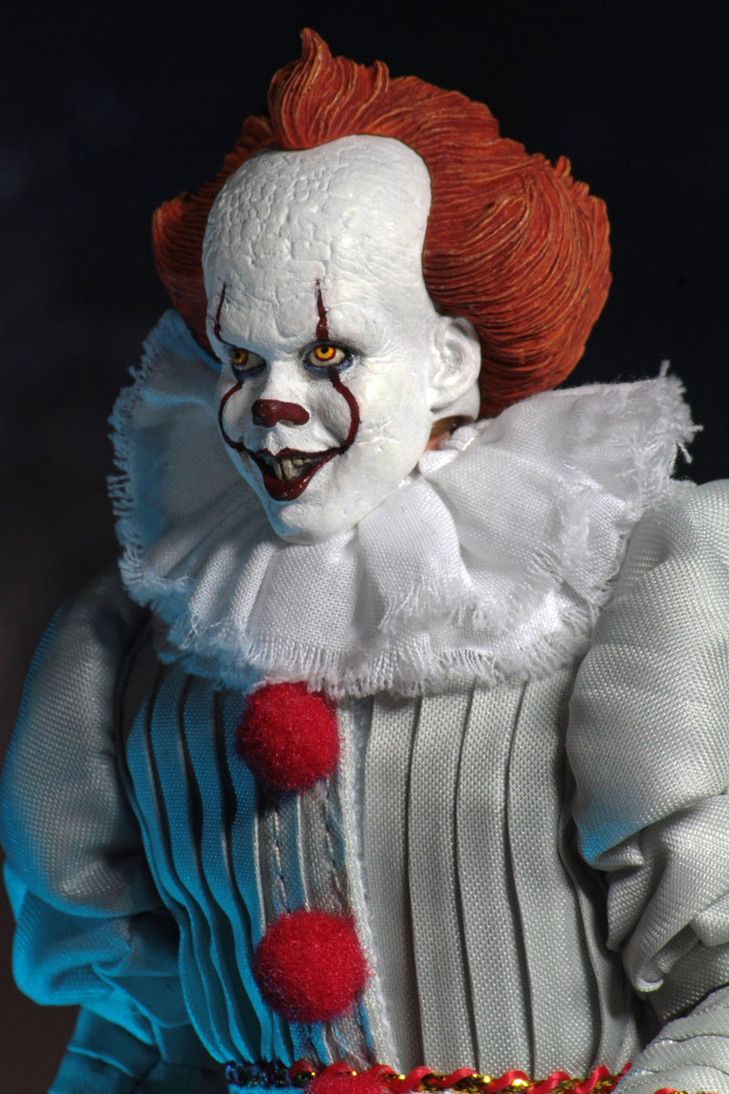 This is an It Movie 2017 Pennywise NECA action figure and he has orange hair, grey suit with red balls, white face, yellow eyes, white fully collar and a creepy smile