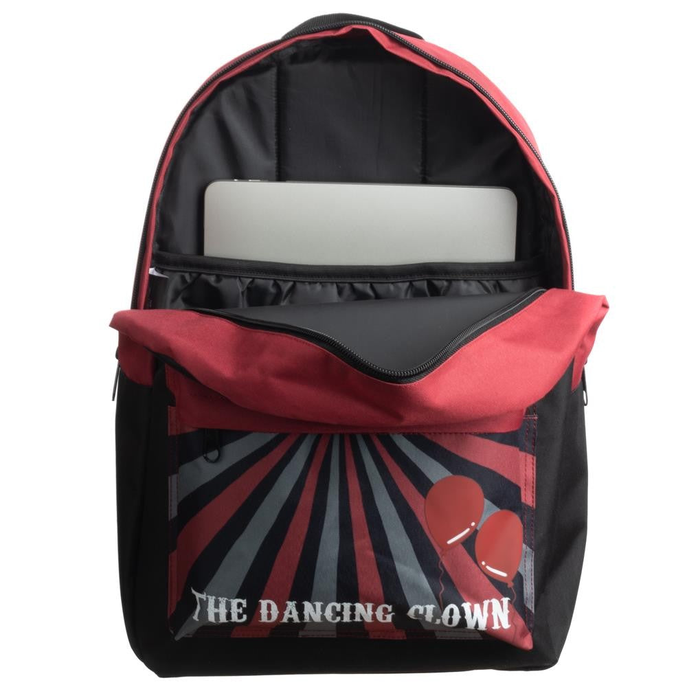 This is an It Movie Pennywise backpack that is black and red, with a zipper on top and a laptop pocket inside.