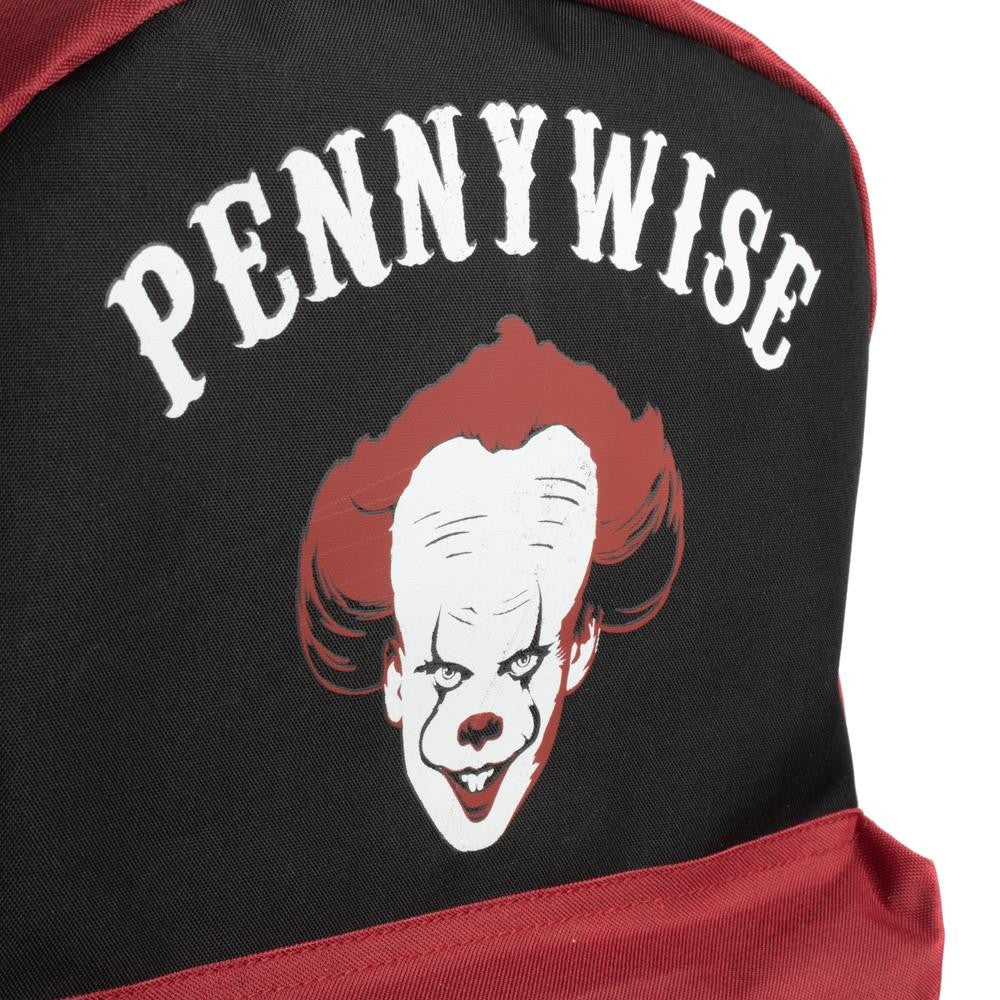 This is an It Movie Pennywise backpack that is black and red, with a clown on the front who has a white face and red hair and lips.