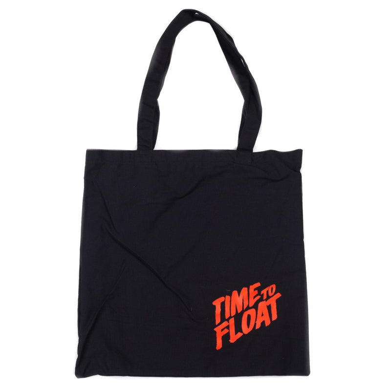 This is an It 2017 Pennywise canvas tote and it is black with handles, with red letters that say time to float. 