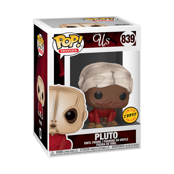 This is a Jordan Peele Us Movie Pluto Chase Pop Vinyl Funko and he is wearing a red jumpsuit with a tan mask and is crouched down on his hands and knees with his burnt face showing.