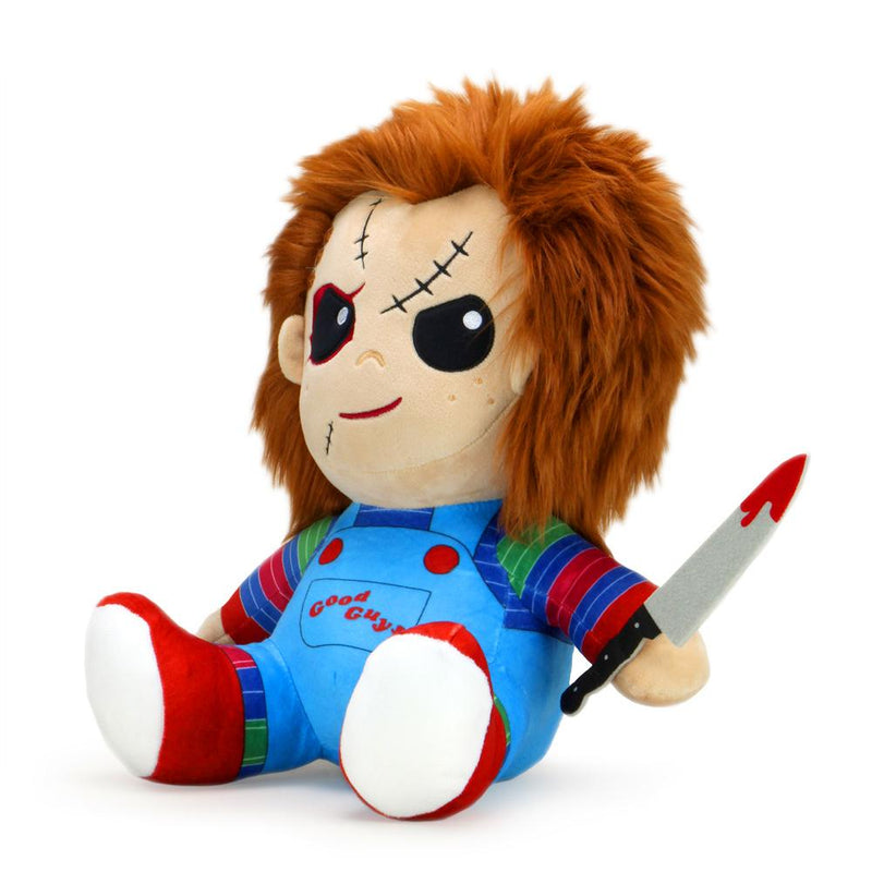 This is a Child's Play Chucky Kidrobot HugMe vibrating plush and he has a striped shirt, red shoes, orange hair, black eyes and is holding a bloody silver knife with a black handle.