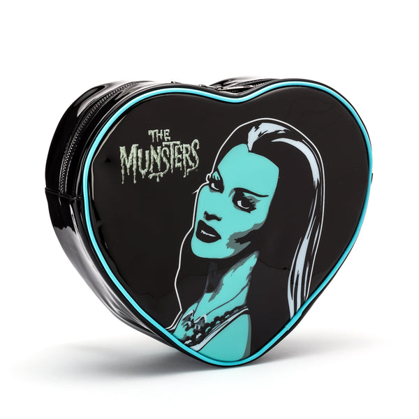 This is a Lily Munster heart shaped backpack purse and she has long black hair.
