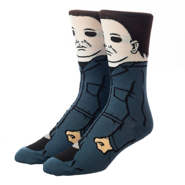 This is a pair of Halloween Michael Myers 360 crew socks and he has on blue coveralls, a white mask and has brown hair.