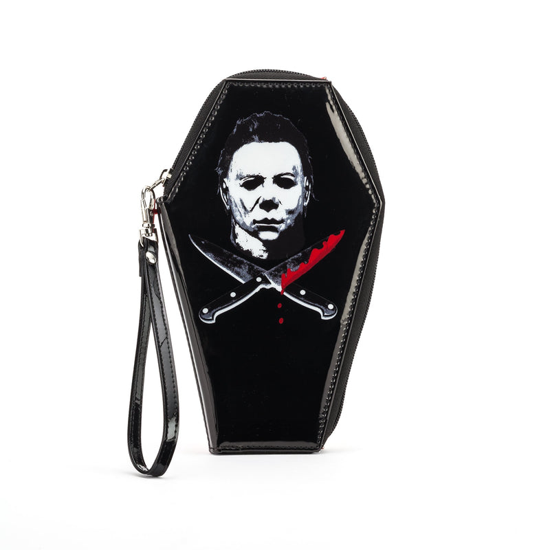 This is a Halloween Michael Myers coffin shaped wallet and it is black with a white mask, two crossed knives with blood.