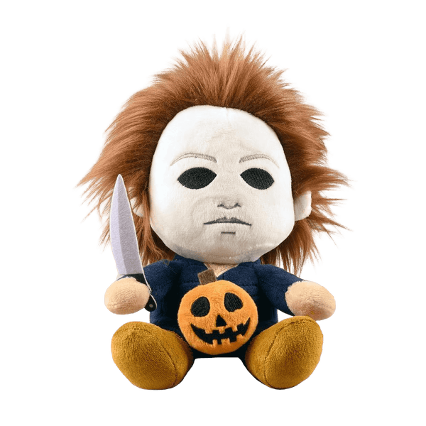 This is the front of a Kidrobot Halloween Michael Myers Phunny stuffed plush that has a white face, brown hair, blue coveralls, a silver knife and orange pumpkin.