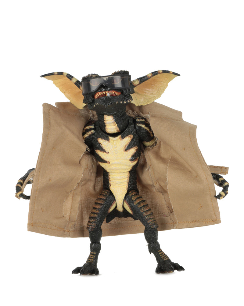 This is a NECA Gremlins flasher ultimate action figure with tan trench coat and glasses.