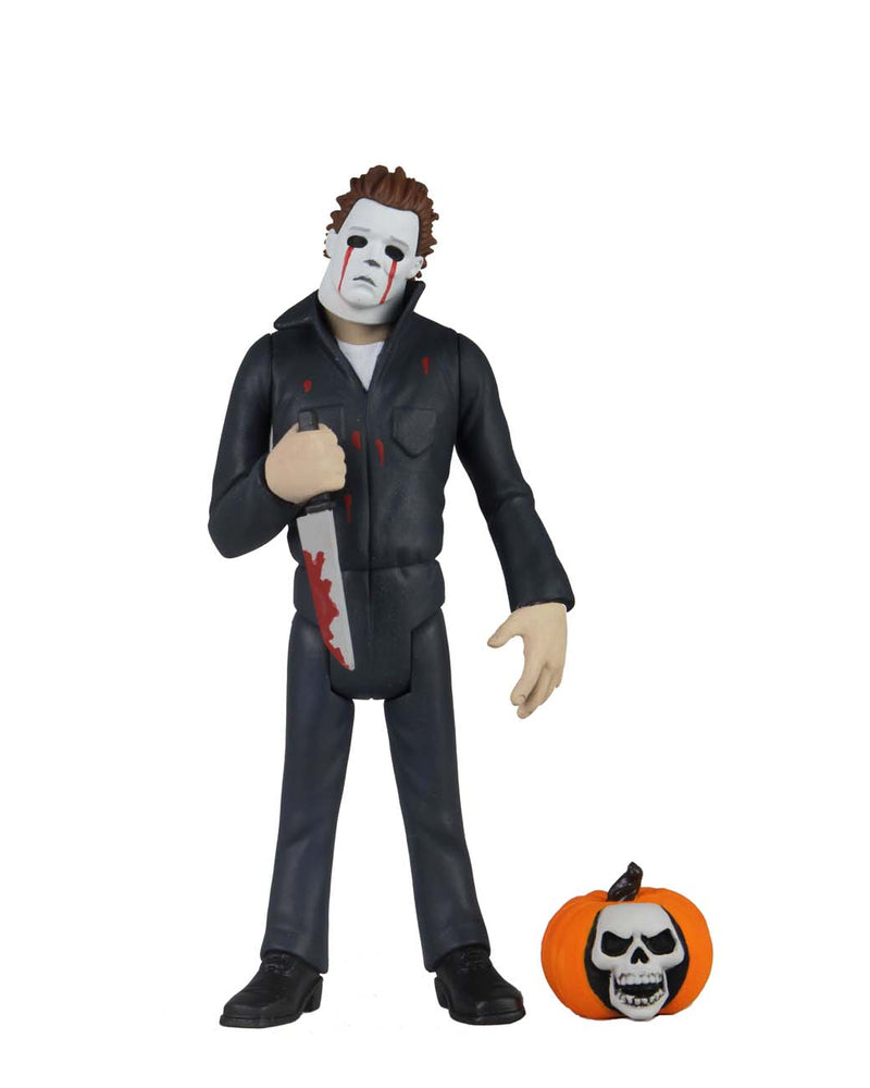 This is NECA Toony Terror Series 5 Halloween 2 Michael Myers and there is a pumpkin with a skull in it.