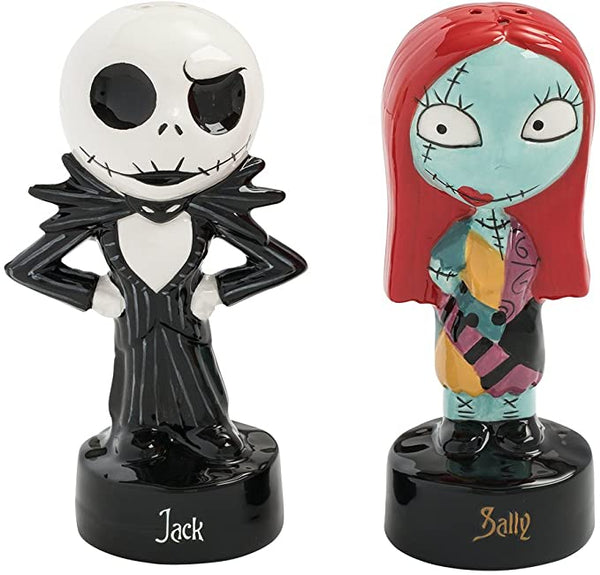 These are Nightmare Before Christmas Jack & Sally salt & pepper shakers and he is white & black with his hand on his hips and she has red hair and a patch dress.
