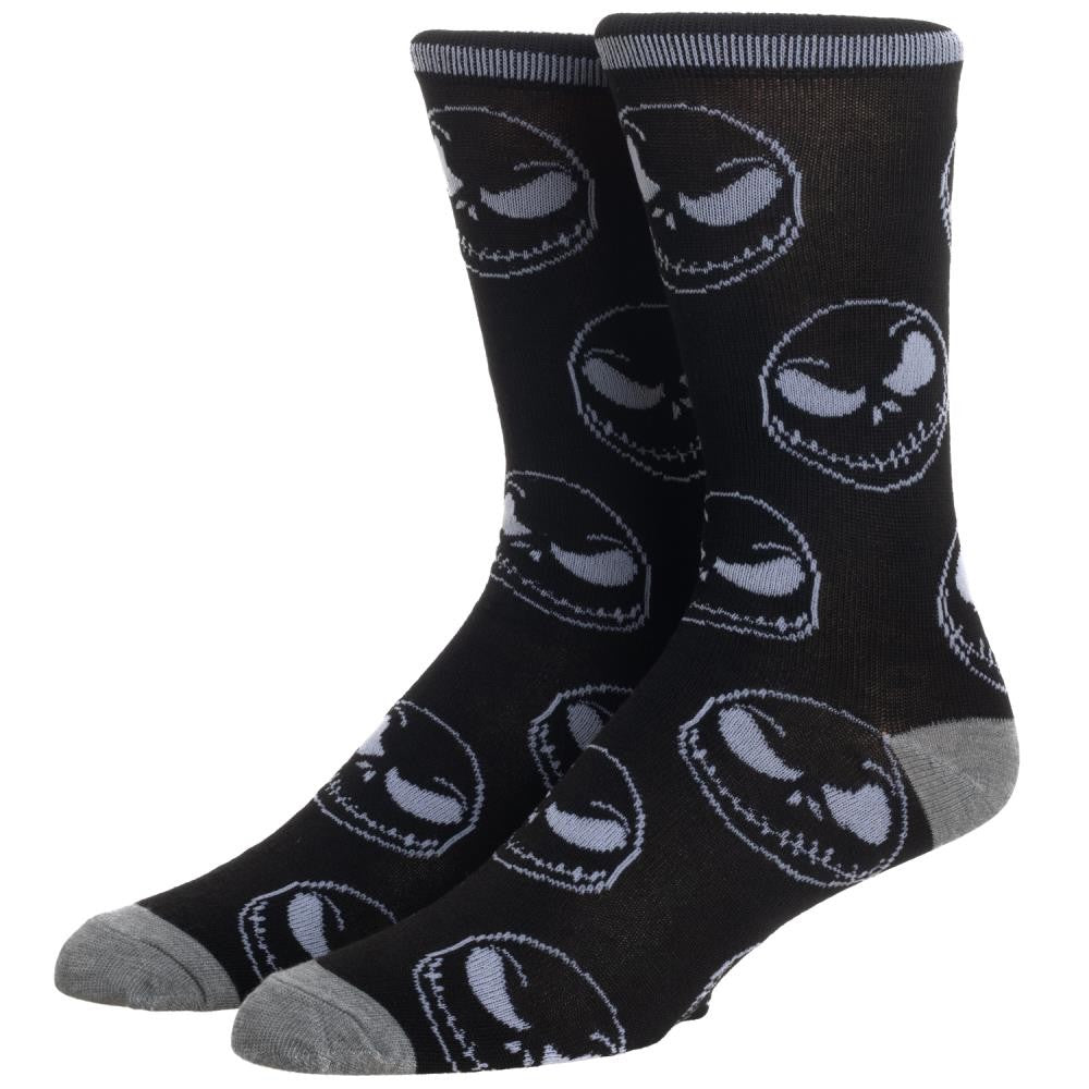 This is a pair of Nightmare Before Christmas Jack Skellington crew socks that are black with grey skull faces.