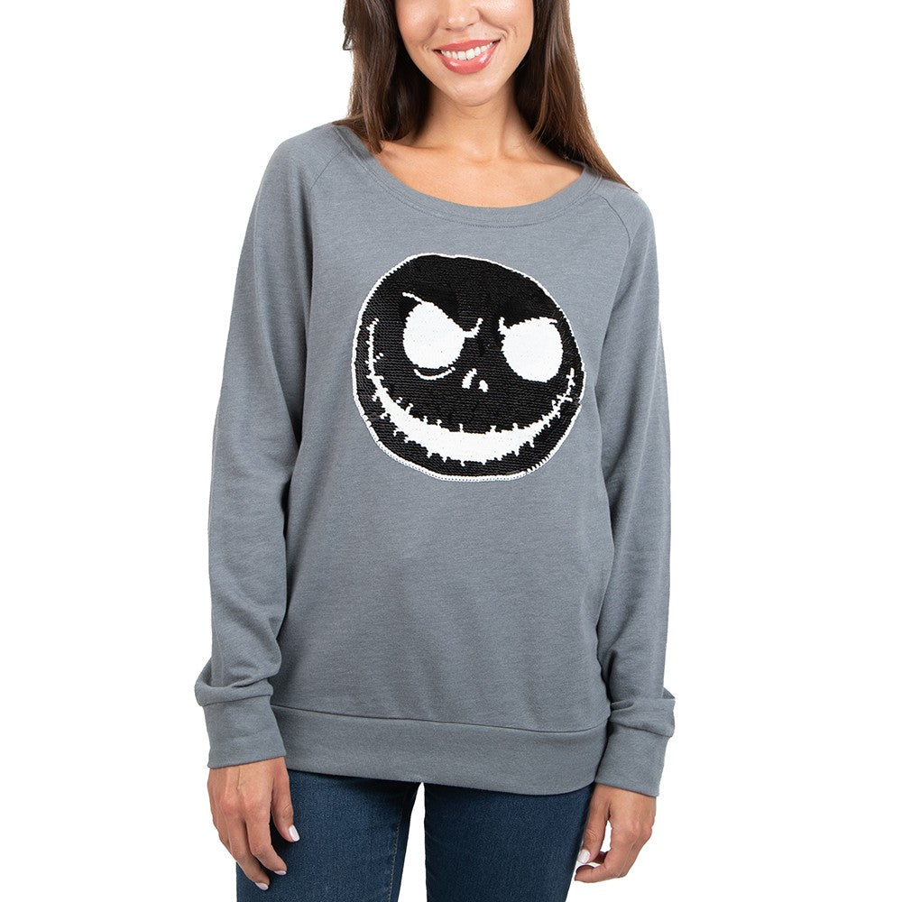 This is a Nightmare Before Christmas Jack Skellington reversible sequin grey sweatshirt and his face is black with white eyes and mouth.