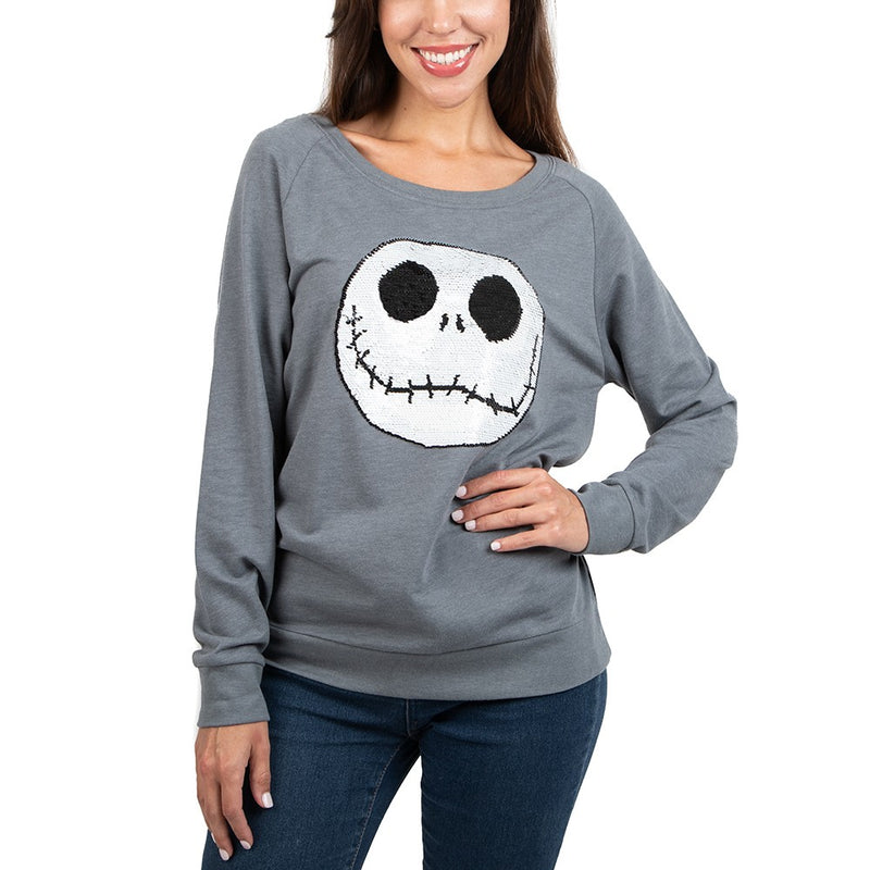 This is a Nightmare Before Christmas Jack Skellington reversible sequin grey sweatshirt and his face is white with black eyes and mouth.