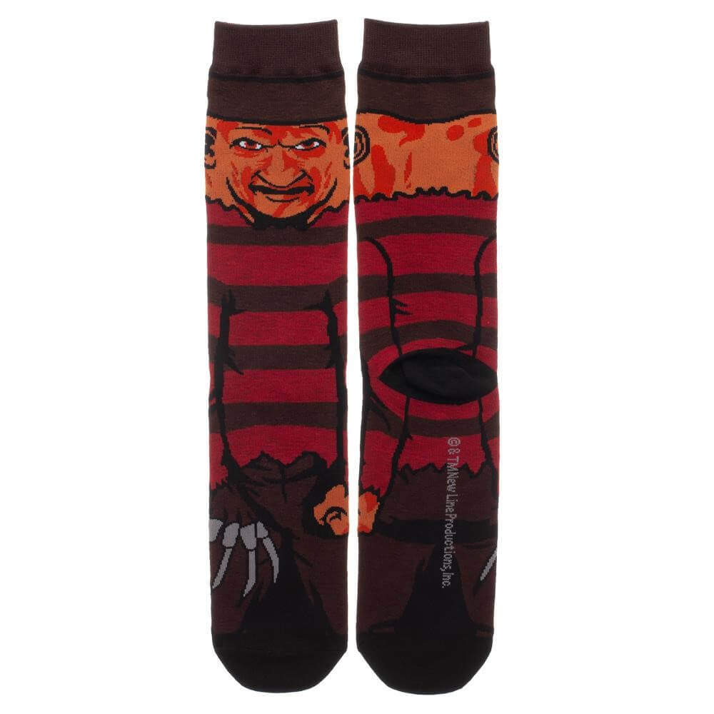 This is a pair of Nightmare On Elm Street Freddy Krueger 360 printed crew socks and he has a burnt face, brown hat and a brown and red sweater with a glove with knives.