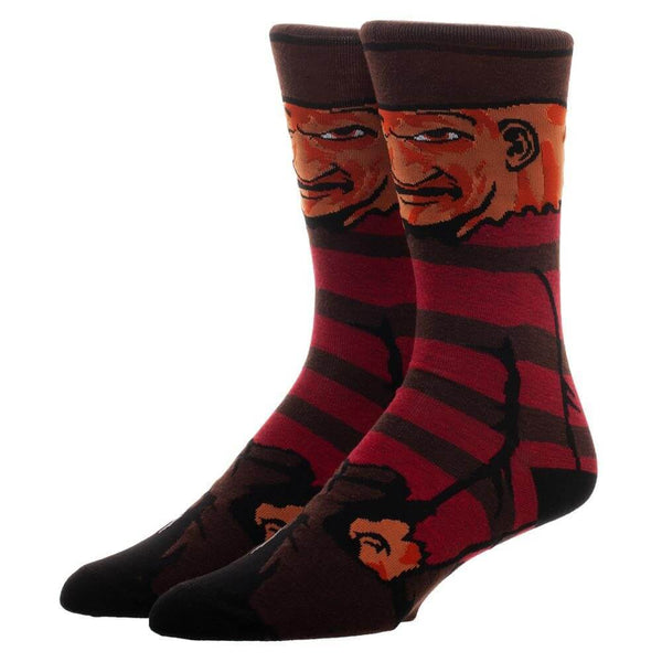 This is a pair of Nightmare On Elm Street Freddy Krueger 360 printed crew socks and he has a burnt face, brown hat and a brown and red sweater.