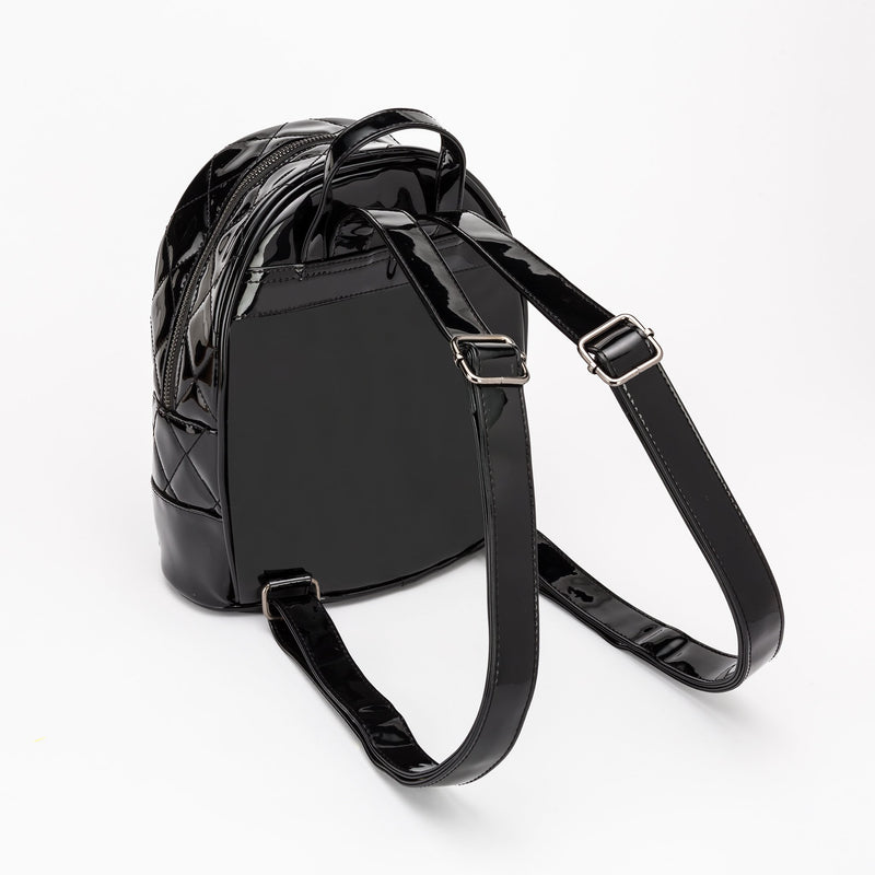 This is a vegan black Universal Monsters purse backpack that is shiny and has straps to wear on your back or a handle.