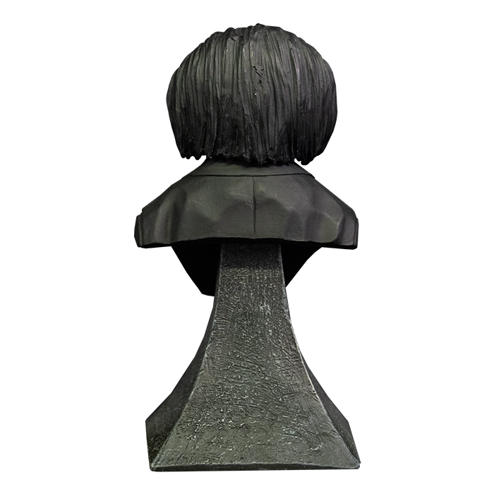 This is a Saw Billy mini bust and he has black hair, black suit and he is on a grey stand.