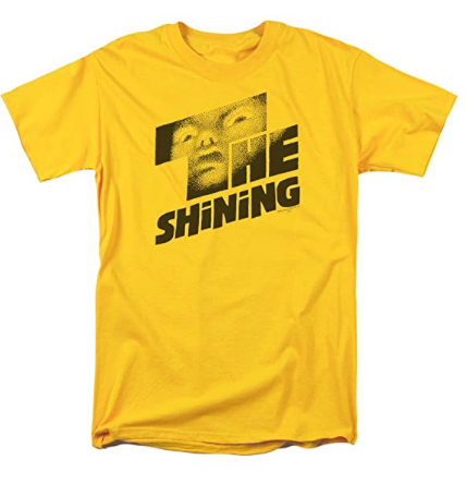 This is a Shining poster t-shirt and it is yellow with black letters and there is a scary face in the T.