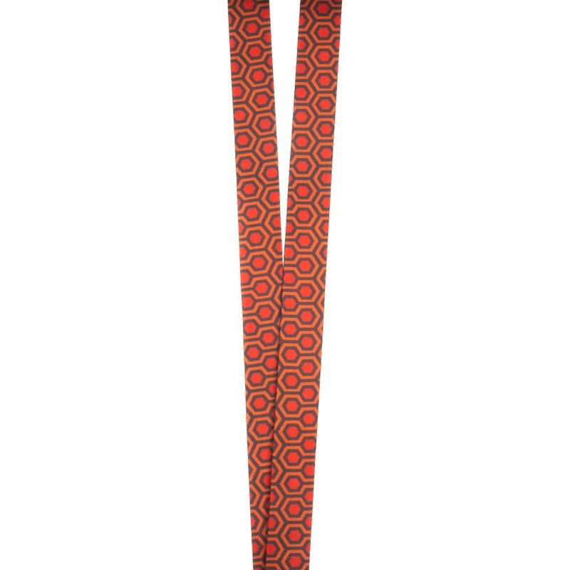 This is a The Shining Grady Twins lanyard and the pattern is the orange carpet from the Overlook Hotel.