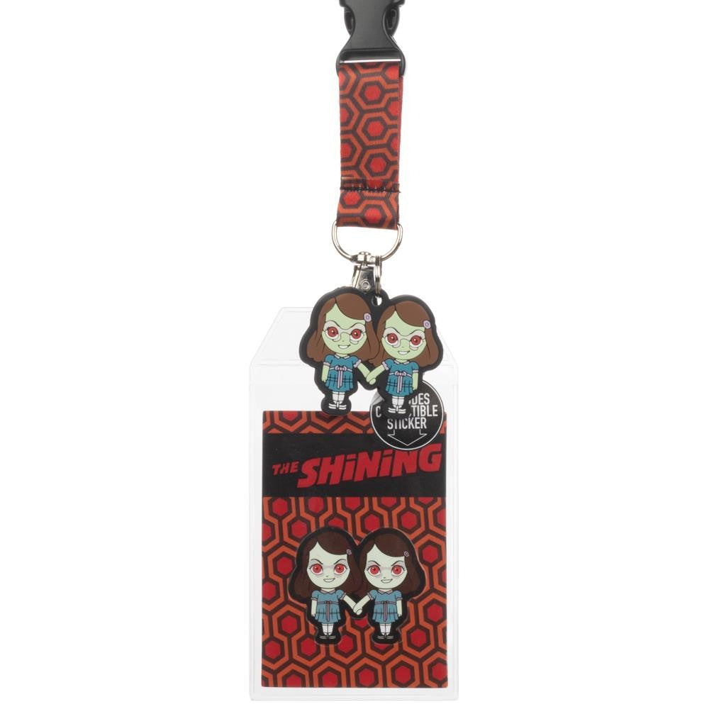 This is a The Shining Grady Twins lanyard and the pattern is the orange carpet from the Overlook Hotel, and the twins are wearing blue dresses and white bows.
