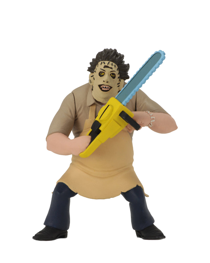 Leatherface action figure is standing in front of a white background, while wearing a yellow apron and holding a yellow chainsaw.