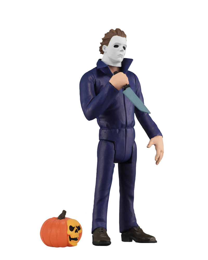 Michael Myers Tooney Terror is standing in blue coveralls with a white background, holding a knife, with a pumpkin at his feet.