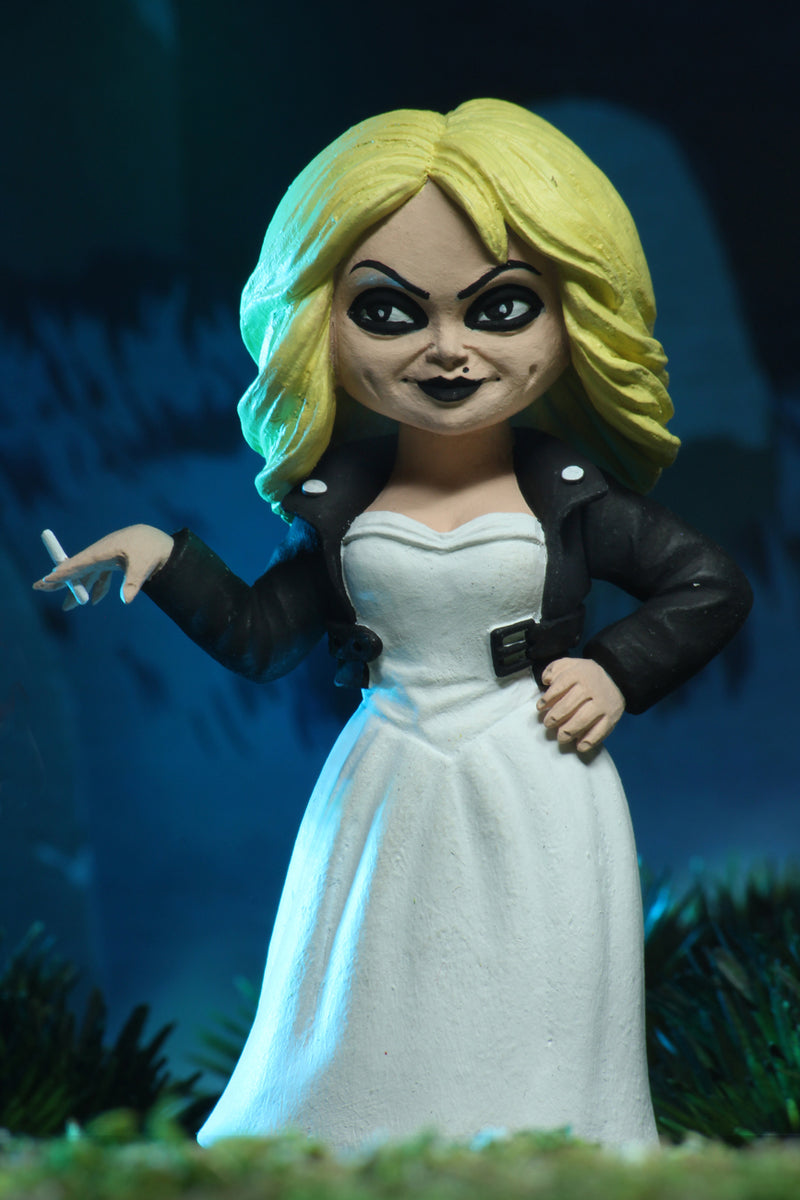 Tiffany NECA action figure Toony Terror is in a white wedding dress and black leather jacket, and holding a cigarette.