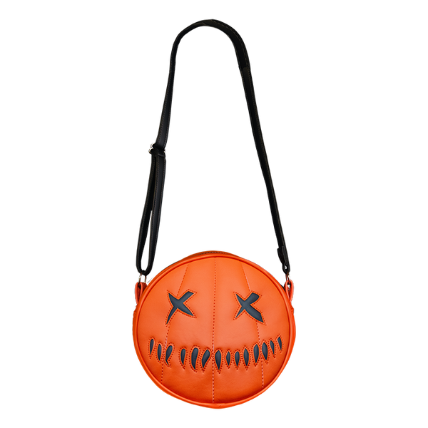 This is a Trick 'R Treat Sam pumpkin purse that is orange and has black eyes and mouth.