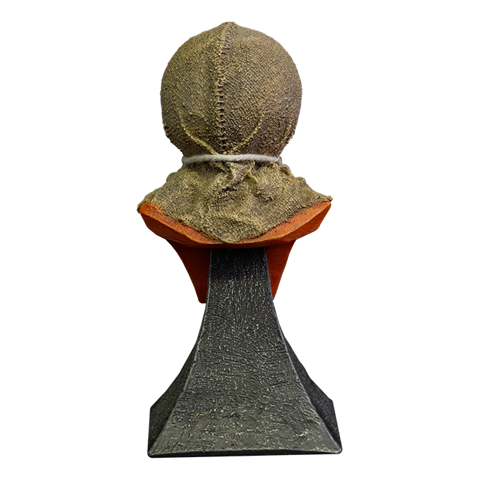 This is a Trick 'r Treat Sam mini bust and he is wearing a burlap mask with a tie around his neck and he is on a grey stand.