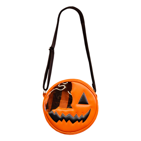 This is a Trick 'R Treat Sam bitten lollipop purse and it is orange, with a black eye and smile and has a black strap.