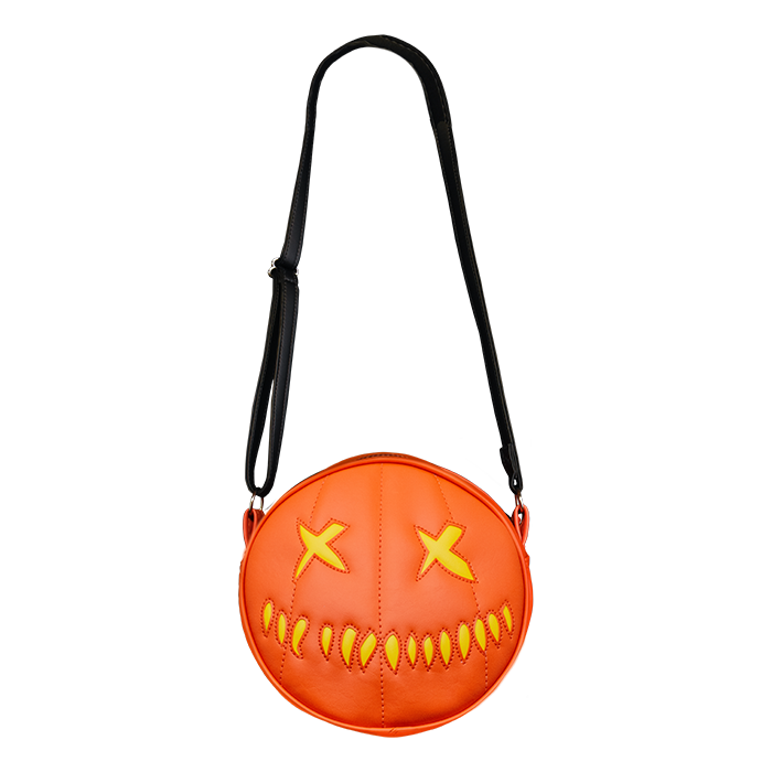 This is a Trick 'R Treat Sam pumpkin purse that is orange and has yellow eyes and mouth.