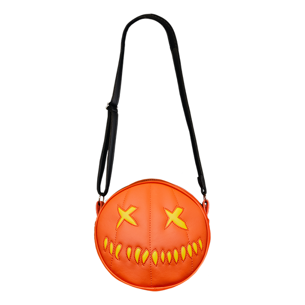 This is a Trick 'R Treat Sam pumpkin purse that is orange and has yellow eyes and mouth.