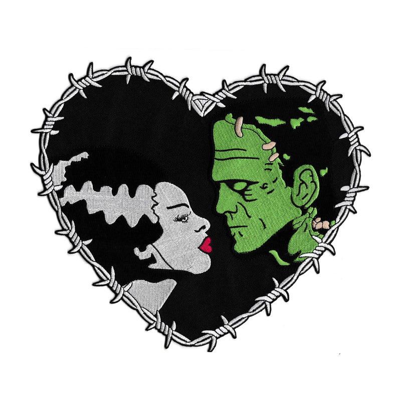 This is a Universal Monsters Bride of Frankenstein Heart back patch and has a woman with a white face, black hair that has a white streak and red lips and a greek man with black hair and stitches in his face.