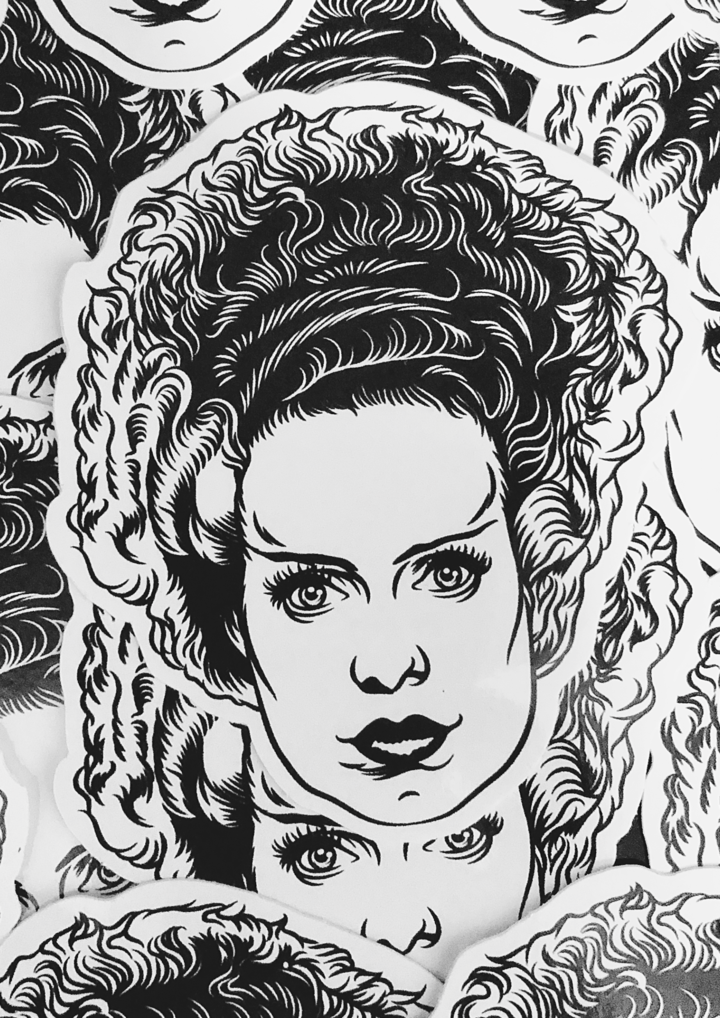 This is a Universal Monsters Bride of Frankenstein face sticker and she has black and white hair. 