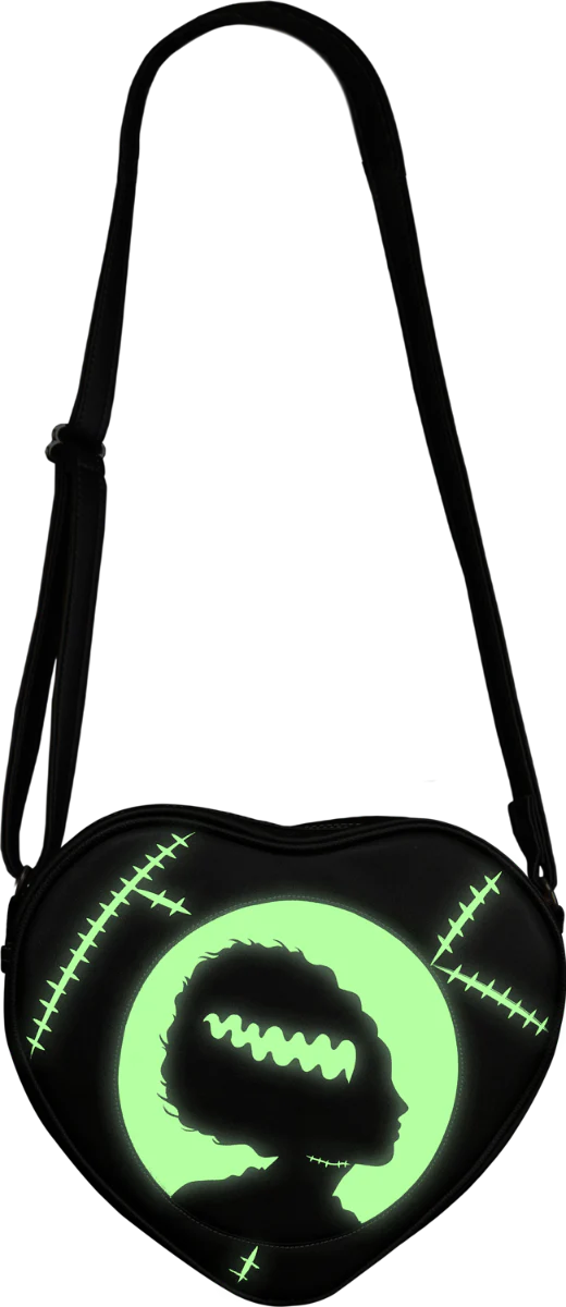 This is a Universal Monsters Bride of Frankenstein purse bag that is black with a strap and the bride silhouette is glow in the dark green