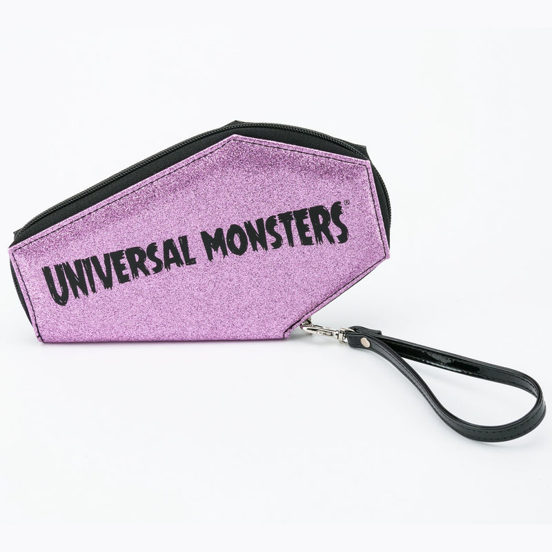This is a Universal Monsters glitter coffin wallet that is black and pink and has a black wrist strap.