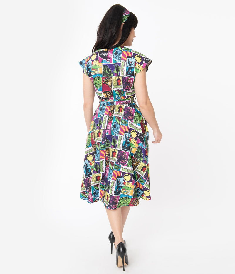This is a Universal Monsters Hedda dress from Unique Vintage and it has Creature From the Black Lagoon, Frankenstein, Dracula, Mummy, Bride and Wolfman and it has a belt and the model is wearing black shoes.