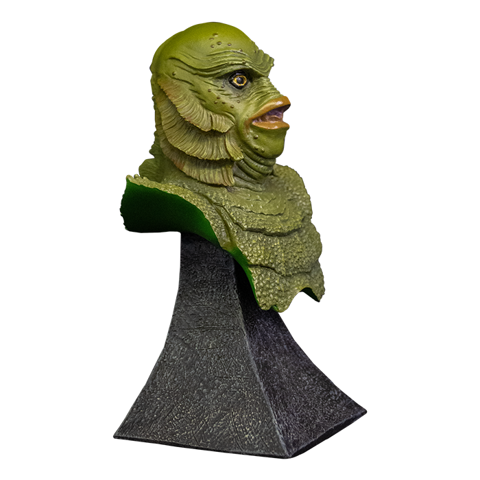 This is a Universal Monsters Creature From the Black Lagoon mini bust that is a green monster with gills and big lips and he is on a grey stand.