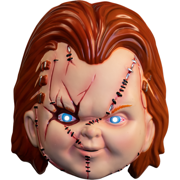 This is a Seed of Chucky vacuform mask and he has orange hair, blue bloodshot eyes, and his face has scars, cuts, staples and stitches.