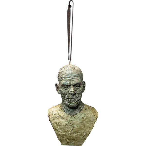 This is a Universal Monsters The Mummy ornament and he is wrapped in fabric and hanging from a ribbon.