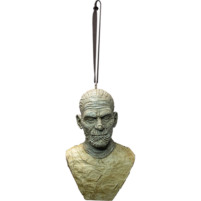 This is a Universal Monsters The Mummy ornament and he is wrapped in fabric and hanging from a ribbon.